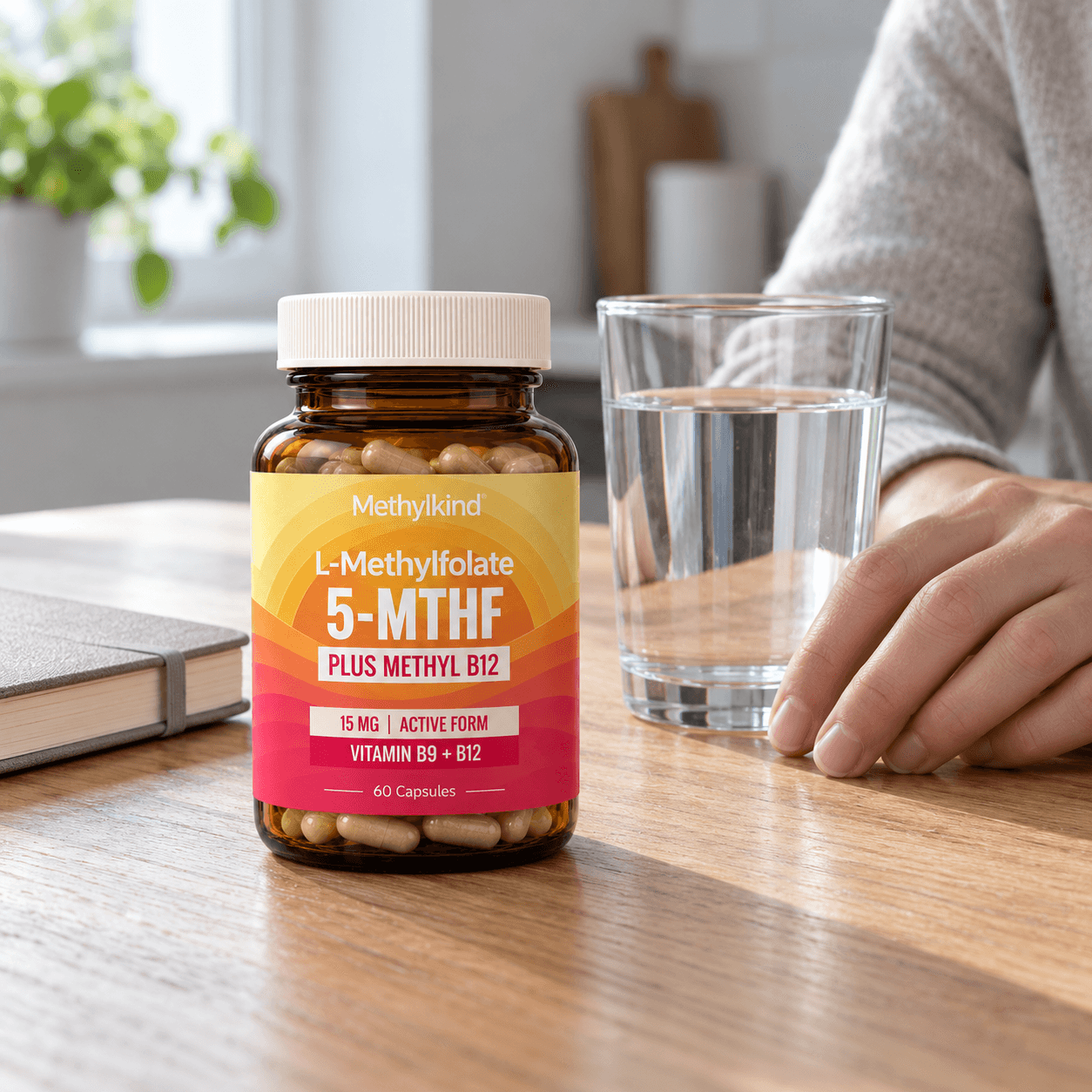 Methylkind bottle on a kitchen table beside a notebook and water